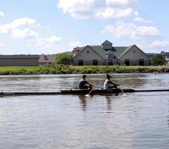Two Rowers from YMCA Quad Cities Rowing on the Slough.